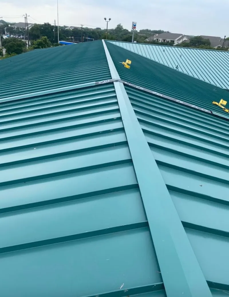 Green commercial metal roof ridge and valley for Metal Roof Repair in Comstock